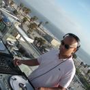 DOSA DJing on a rooftop